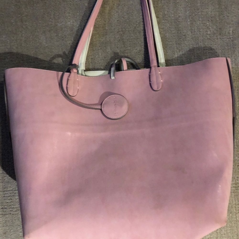 Pink reversible bag with matching crossbody.